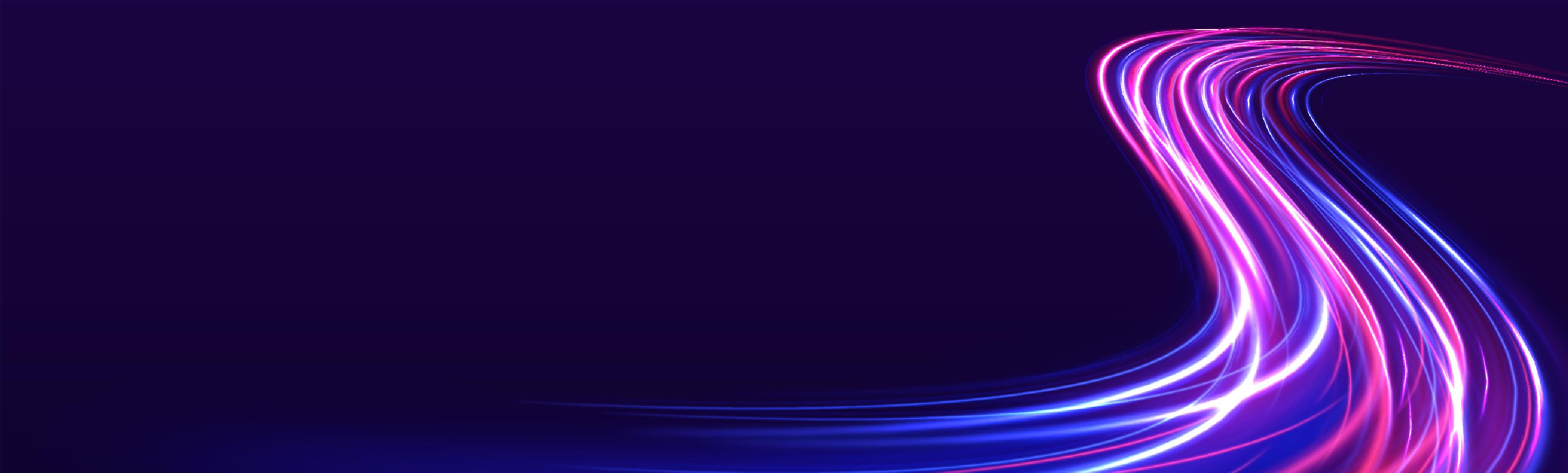 pink and blue light trails on a dark navy background